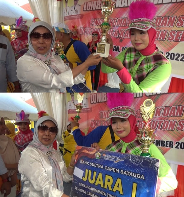 Ketua DWP Provinsi Sultra Dra. Wa Ode Munana Asrun Lio menyerahkan Piala dan Hadiah kepada Perwakilan Tim Senam Garbarata SMAN 2 Baubau sebagai Juara 1 Lomba di SMAN 1 Batauga Sabtu (10/9)